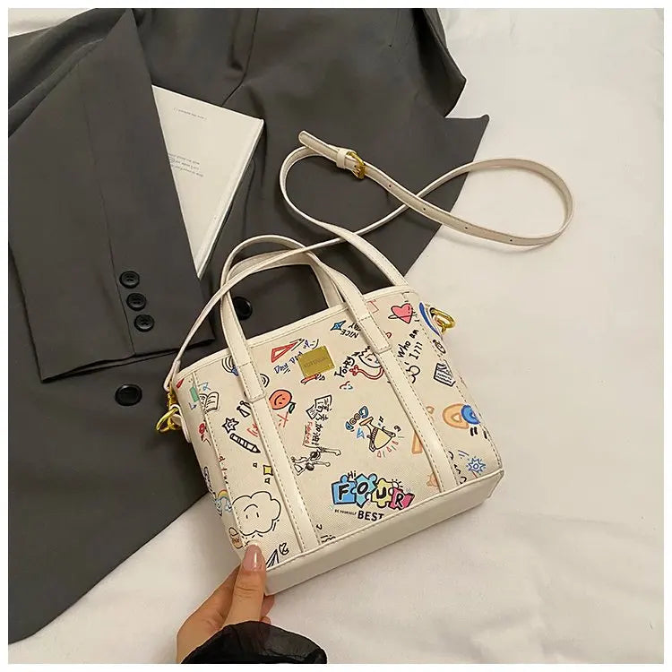‌Women's Fashion Bucket Bag 2025New PU Leather Graffiti Print Crossbody Bag Adjustable Long Strap Casual Purse for Work & Dating