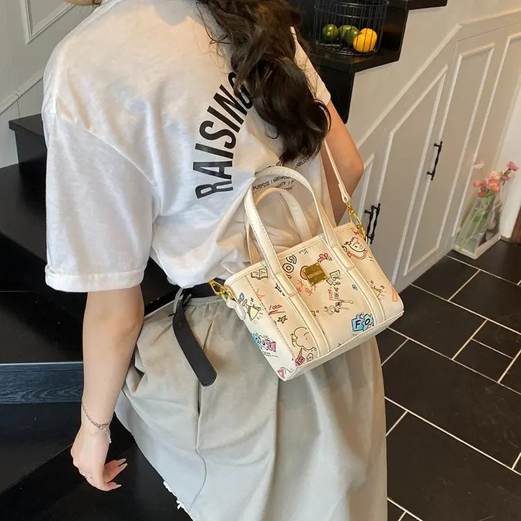 ‌Women's Fashion Bucket Bag 2025New PU Leather Graffiti Print Crossbody Bag Adjustable Long Strap Casual Purse for Work & Dating