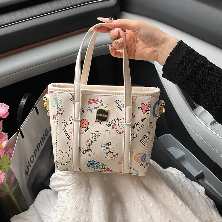‌Women's Fashion Bucket Bag 2025New PU Leather Graffiti Print Crossbody Bag Adjustable Long Strap Casual Purse for Work & Dating